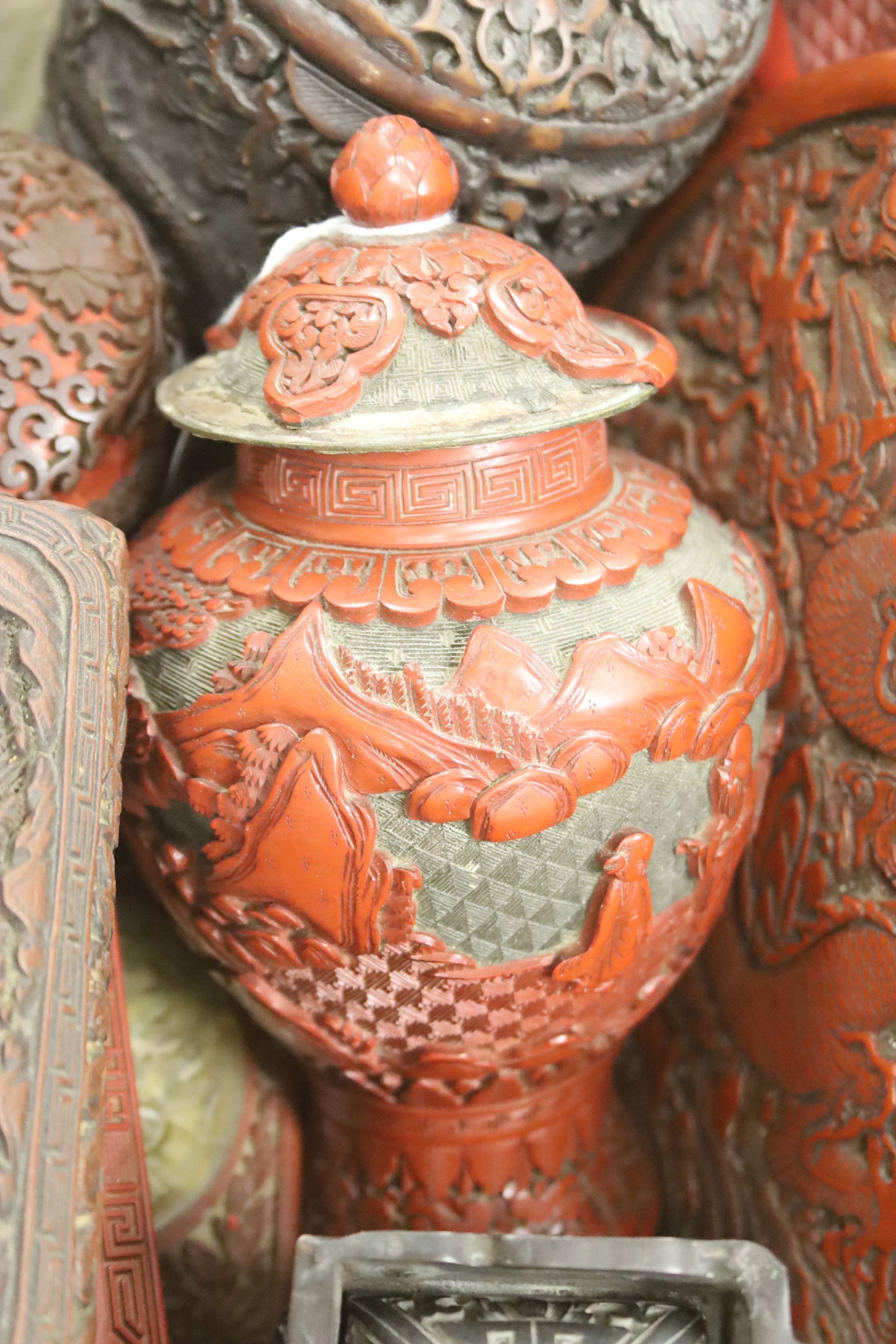 A quantity of Chinese cinnebar lacquer and simulated lacquer boxes, vases, etc.